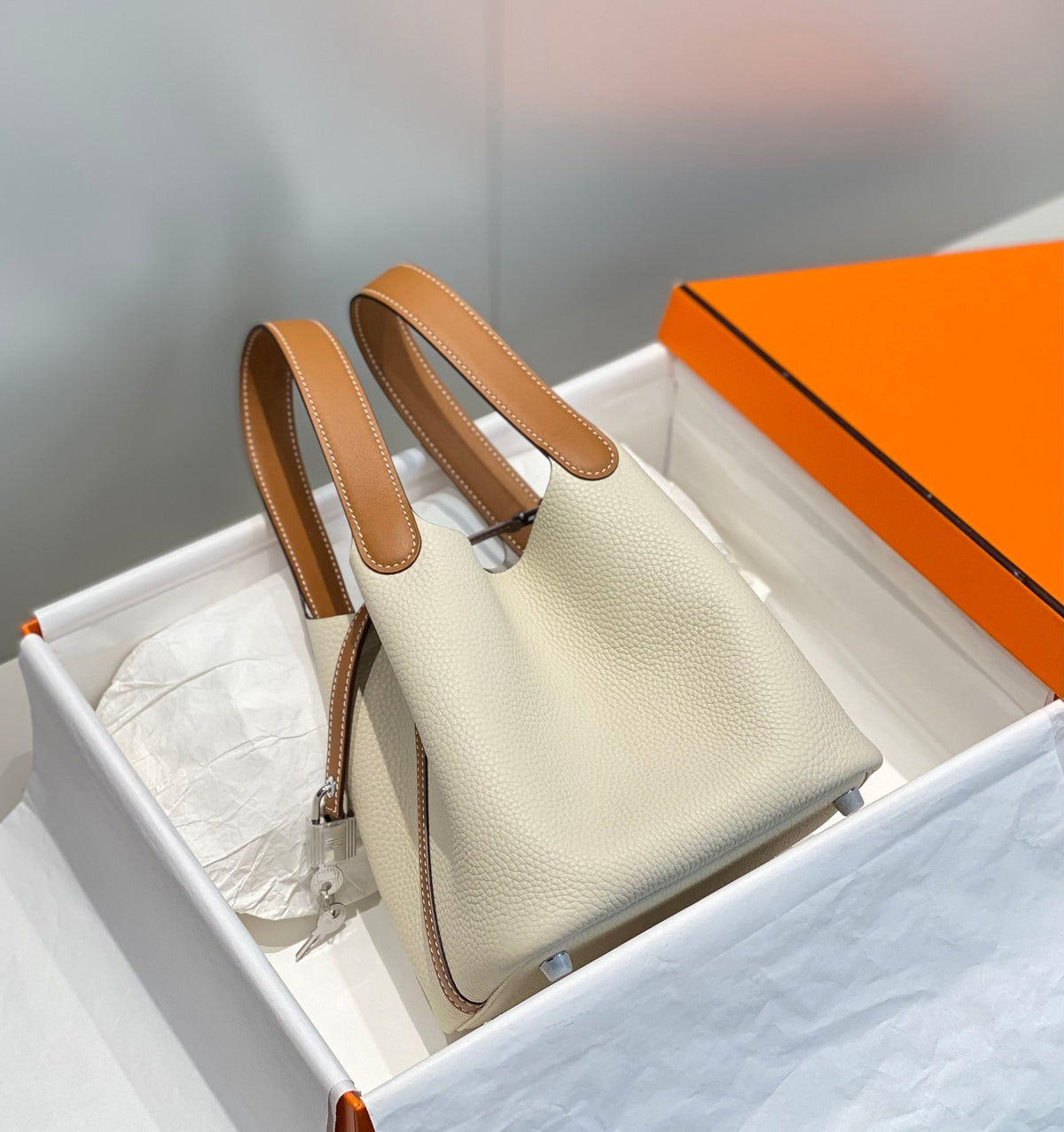 HERMES 25S PICOTIN LOCK 18 IN BURNT ORANGE AND IVORY CALFSKIN SILVER HARDWARE