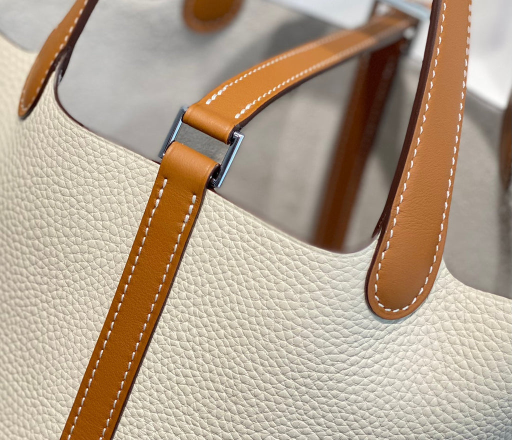 HERMES 25S PICOTIN LOCK 18 IN BURNT ORANGE AND IVORY CALFSKIN SILVER HARDWARE