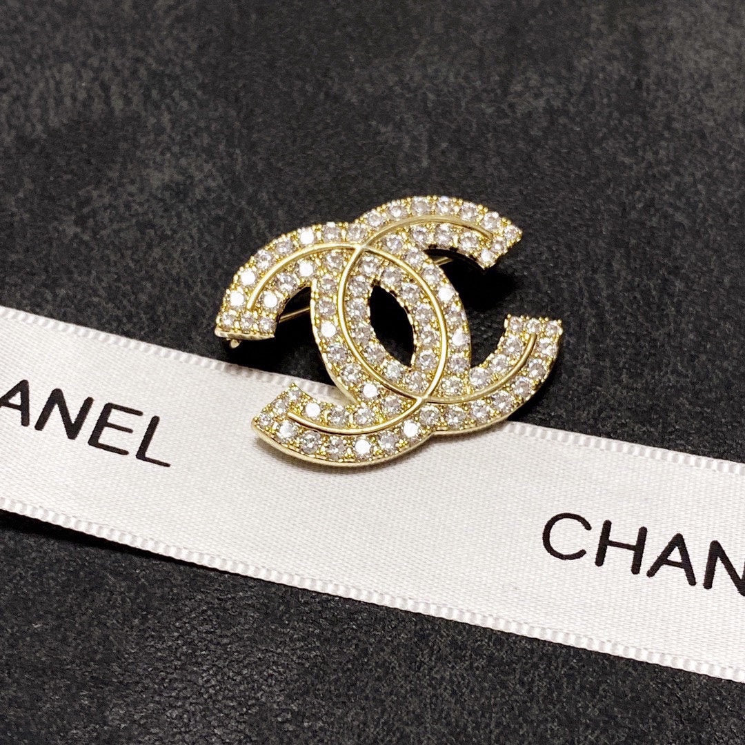 18K  Chanel Diamonds Set Broochs